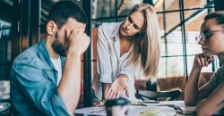 Woman chastising man during meeting